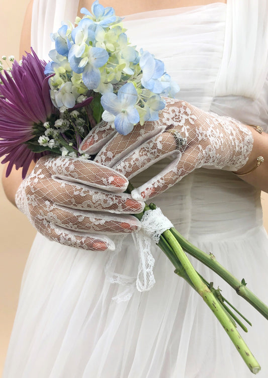 floral lace gloves holding flowers