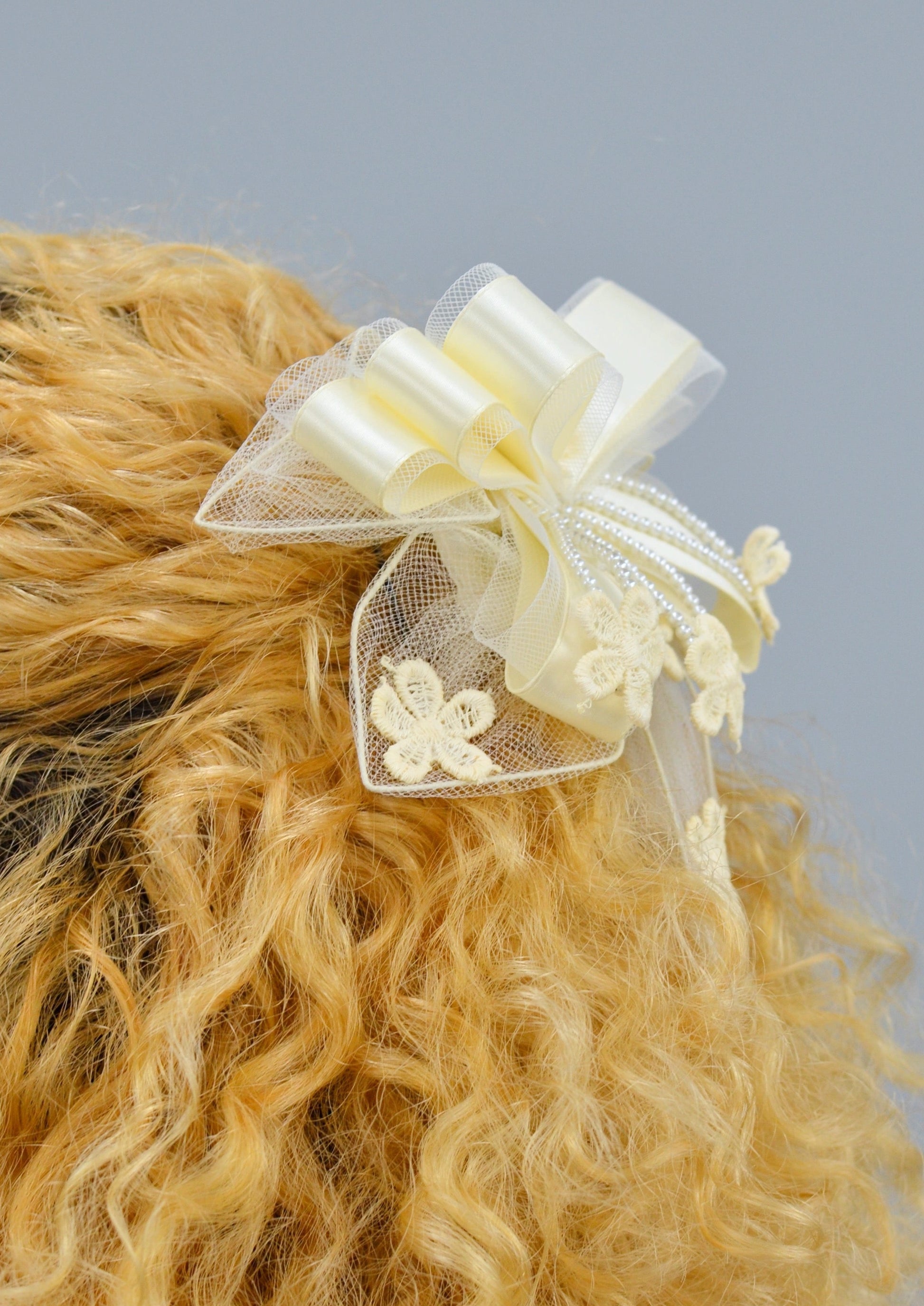 side view of ivory ribbon lace hair piece